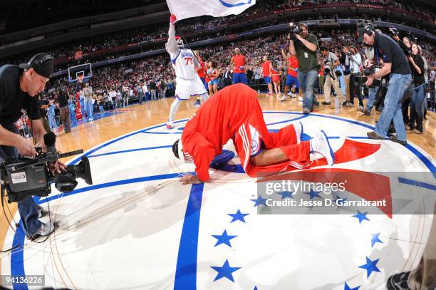 Allen Iverson of the Philadelphia 76ers kisses his new home court before the game against the Denver Nuggets on December 7, 2009 at the Wachovia...