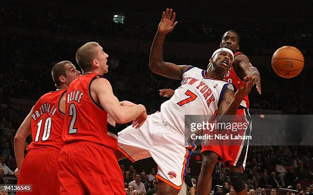 Al Harrington of the New York Knicks has the ball blocked by Martell Webster of the Portland Trail Blazers at Madison Square Garden on December 7,...