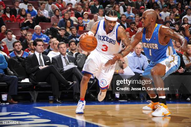 Allen Iverson of the Philadelphia 76ers drives the ball against Chauncey Billups of the Denver Nuggets during the game on December 7, 2009 at the...