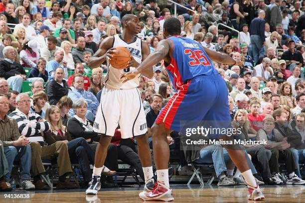 Ronnie Brewer of the Utah Jazz moves the ball against DaJuan Summers of the Detroit Pistons during the game on November 21, 2009 at EnergySolutions...