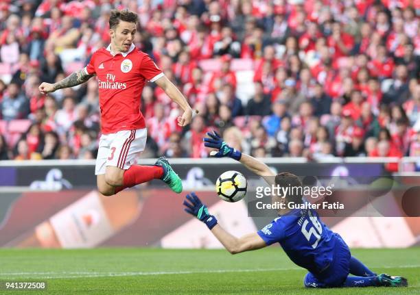 Benfica defender Alejandro Grimaldo from Spain with Vitoria Guimaraes goalkeeper Miguel Silva from Portugal in action during the Primeira Liga match...