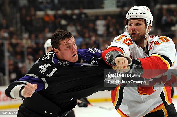 Brian McGrattan of the Calgary Flames punches Raitis Ivanans of the Los Angeles Kings during the game on December 7, 2009 at Staples Center in Los...