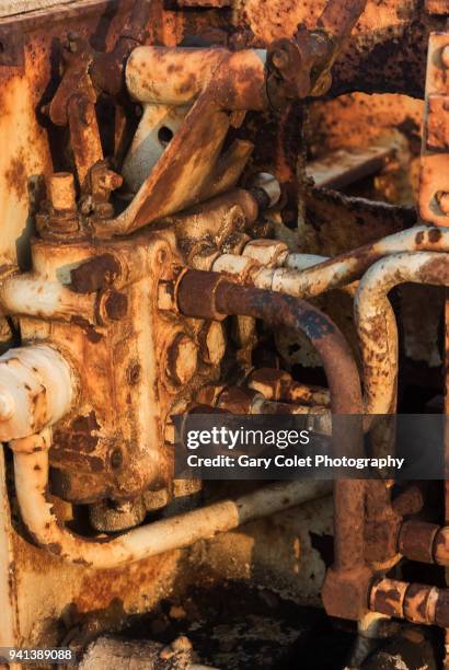 rusty engine of disused bulldozer - gary colet stock pictures, royalty-free photos & images