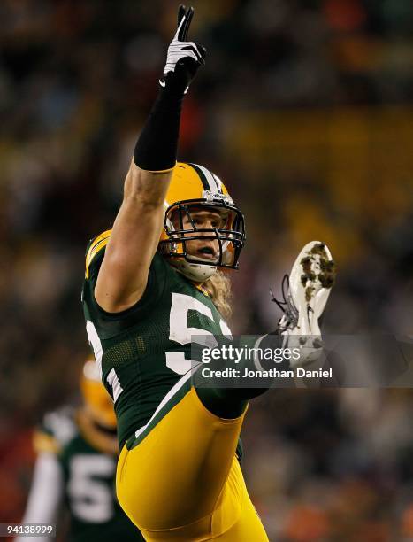 Clay Matthews of the Green Bay Packers celebrates a sack against Joe Flacco of the Baltimore Ravens at Lambeau Field on December 7, 2009 in Green...