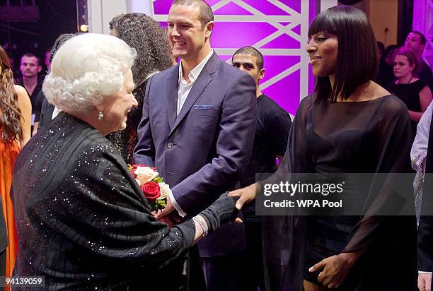 Queen Elizabeth II meets singer Alexandra Burke following the Royal Variety Performance on December 7, 2009 in Blackpool, England