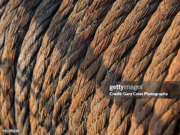 rusty metal cable on a drum - gary colet stock pictures, royalty-free photos & images