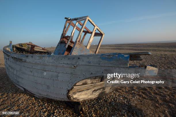 dungeness wrecked boat on shingle beach - gary colet stock pictures, royalty-free photos & images