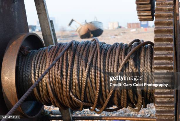 rusty beach winch and abandoned fishing boat - gary colet stock pictures, royalty-free photos & images