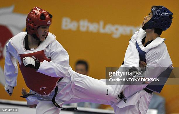 Yun Hee-sung of South Korea fights with Yin Zhimeng of China in the under 84 kg men's taekwondo finals during the 2009 East Asian Games in Hong Kong...
