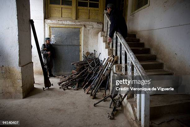 Weapons which were recovered during the Disarmament Demobilisation and Reintegration process are displayed at the police headquarters in Faryab,...