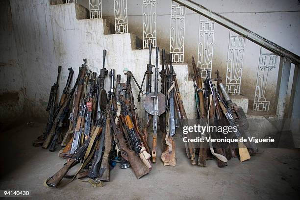 Weapons which were recovered during the Disarmament Demobilisation and Reintegration process are displayed at the police headquarters in Faryab,...