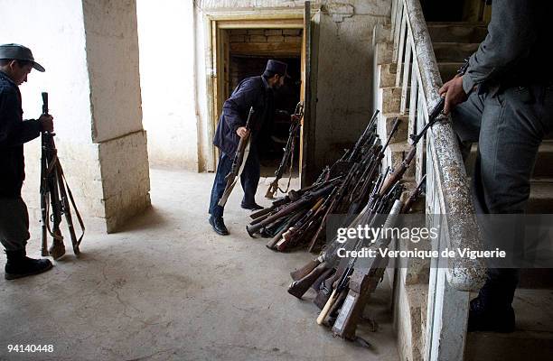 Weapons which were recovered during the Disarmament Demobilisation and Reintegration process are displayed at the police headquarters in Faryab,...