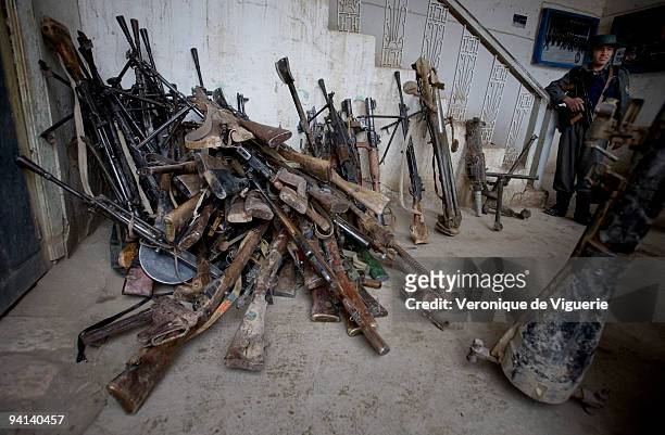 Weapons which were recovered during the Disarmament Demobilisation and Reintegration process are displayed at the police headquarters in Faryab,...