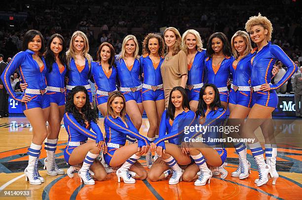 Celine Dion poses with Knicks City Dancers at the Portland Trailblazers Vs. New York Knicks game at Madison Square Garden on December 7, 2009 in New...