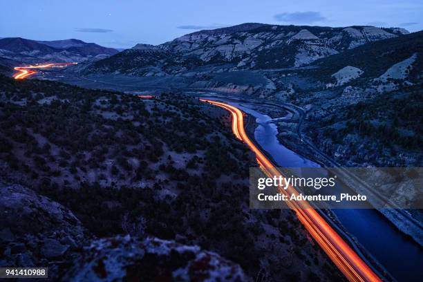 glenwood canyon i-70 curves at night dusk view - long exposure light trail stock pictures, royalty-free photos & images