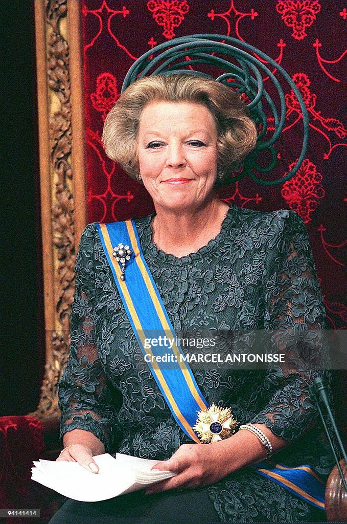 Dutch Queen Beatrix smiles reading the Q