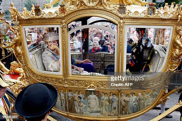 Dutch queen Beatrix , Crownprince Willem Alexander and Princess Maxima ride in the Golden Carriage from palace Noordeinde to the Knights' Hall in The...