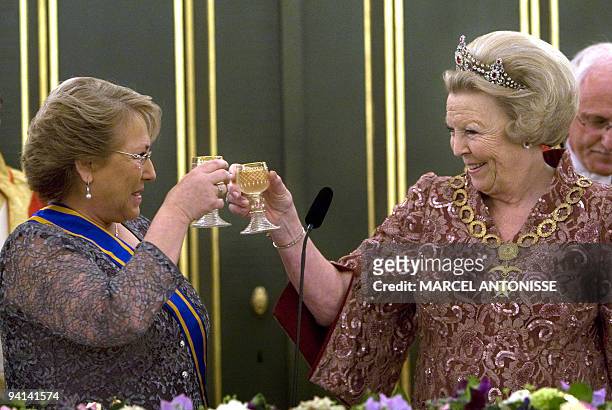 The President of Chile Michelle Bachelet and Dutch Queen Beatrix toast during the state banquet in Royal Palace Noordeinde in The Hague, on May 25,...