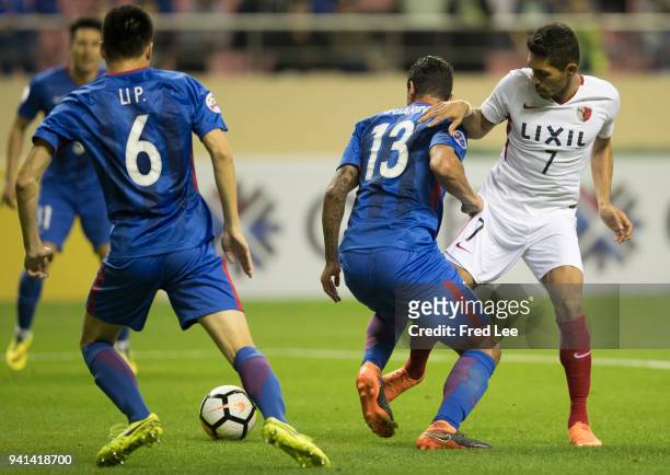 Pedro Bispo Junior of Kashima Antlers in action with Fredy Guarín of Shanghai Shenhua during the 2018 AFC Champions League match between Shanghai...
