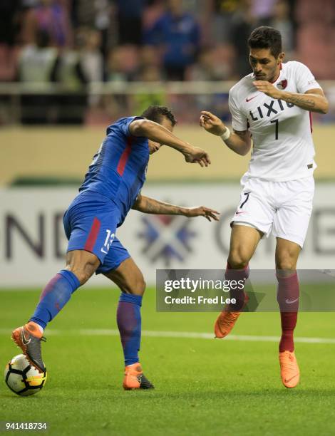 Pedro Bispo Junior of Kashima Antlers in action with Fredy Guarín of Shanghai Shenhua during the 2018 AFC Champions League match between Shanghai...