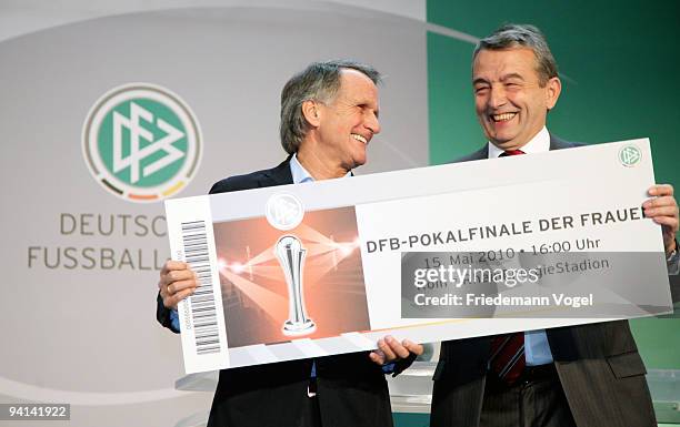 President of FC Koeln Wolfgang Overath receive the first ticket for the Women's DFB Cup Final 2010 from Secretary General of the German DFB Wolfgang...