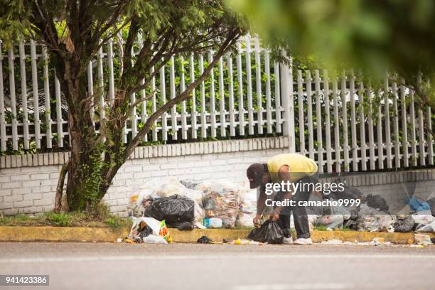 economic crisis in venezuela leads people searching for food on streets - venezuela stock pictures, royalty-free photos & images