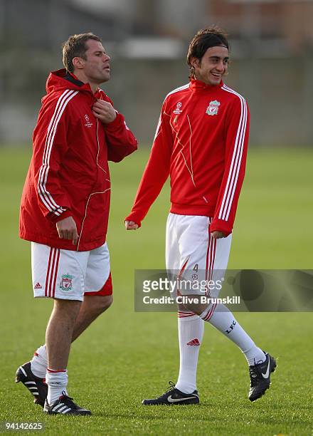 Alberto Aquilani of Liverpool in good spirits alongside team mate Jamie Carragher during a training session prior to the UEFA Champions League Group...