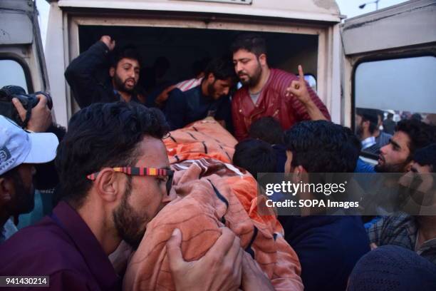 Kashmiri Boy kisses the feet of Gowhar Ahmed. Kashmiri locals carrying the dead body of a Civilian Gowhar Ahmed from the hospital. Gowhar was injured...