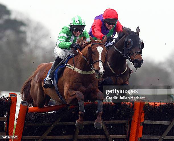 Tom Molloy and Comprimario go on to win from Dalrymple ridden by Marc Goldstein as they jump the last flight to land The He Shot, He Scored, Peter...