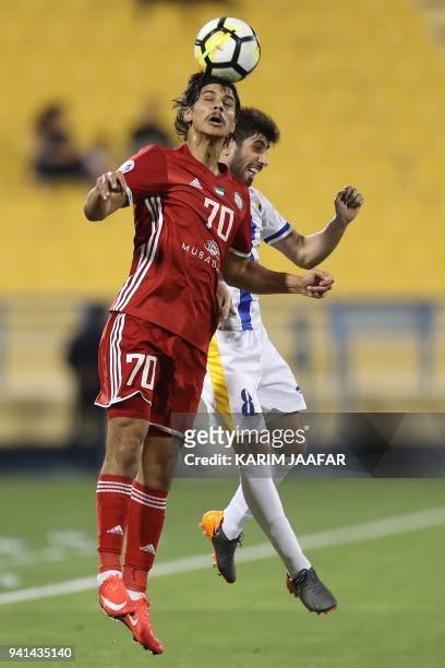 Al Jazira's Ahmed Husain Al Hashmi vies with Al Gharafa's Yousuf Muftar during the AFC Champions League match between Qatar's al-Gharafa and UAE's...