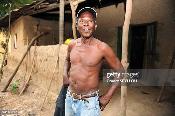 Victor, whose children were killed during an attack several years ago, stands in front of his house on December 2, 2009 in Djifangor, in the southern...