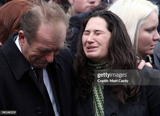 John Amer, father of Acting Sergeant John Paxton Amer of 1st Battalion Coldstream Guards, reacts as the hearse carrying his son's coffin passes on...