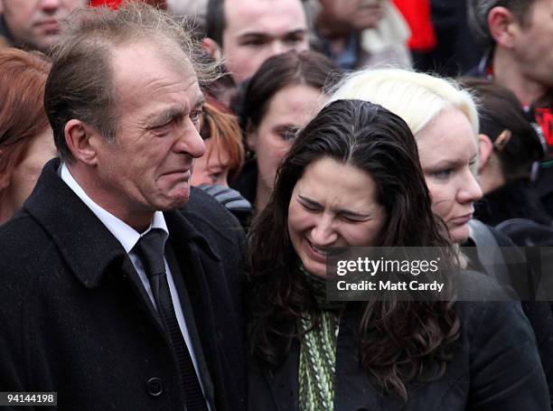 John Amer, father of Acting Sergeant John Paxton Amer of 1st Battalion Coldstream Guards, reacts as the hearse carrying his son's coffin passes on...