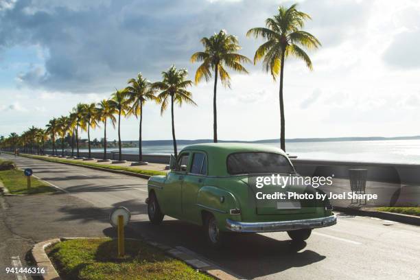 classic cuba vintage car driving - havana stockfoto's en -beelden