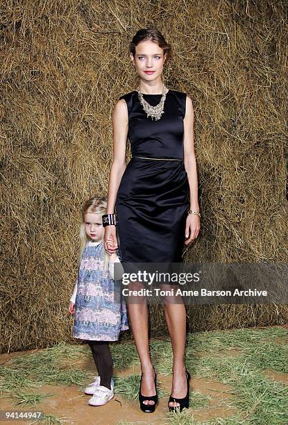 Natalia Vodianova and daughter attend the Chanel Pret a Porter show as part of the Paris Womenswear Fashion Week Spring/Summer 2010 at the Grand...