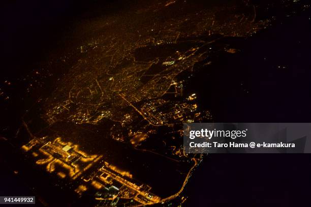 residential district and changi airport in singapore, night time aerial view from commercial airplane - changi airport stock pictures, royalty-free photos & images