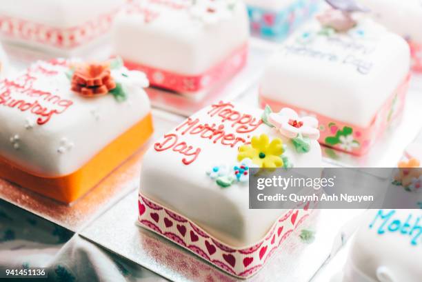 cakes decorated with marzipan for mother's day - marzipan stock-fotos und bilder