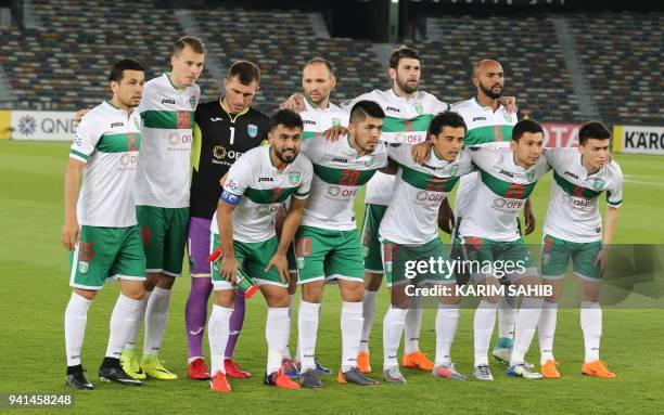 Lokomotiv's players pose for a photograph prior to the AFC Champions League football match between Al-Wahda and FC Lokomotiv at the Sheikh Zayed...