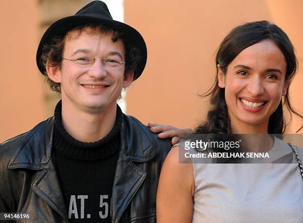 French actors Amellle Chahbi and Julien Courbey pose during a photocall at the 9th edition of the Marrakesh International Film Festival on December...