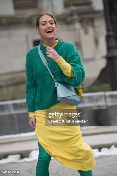 Fashion stylist Emili Sindlev wears a Loewe bag, Mulberry boots, Paco Rabanne knit dress and a Designers Remix sweater day 4 of Paris Womens Fashion...