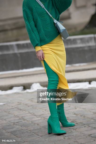 Fashion stylist Emili Sindlev wears a Loewe bag, Mulberry boots, Paco Rabanne knit dress and a Designers Remix sweater day 4 of Paris Womens Fashion...