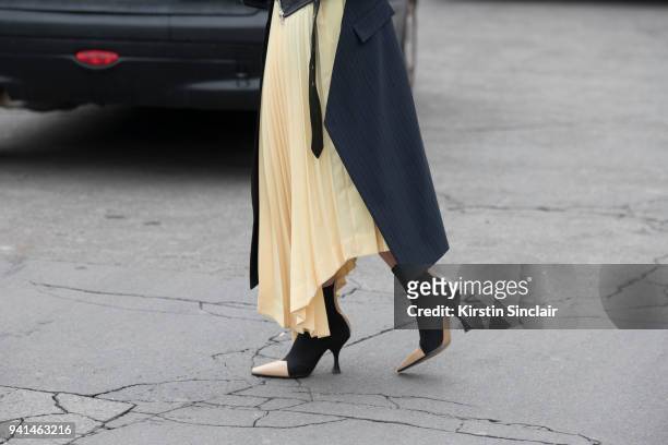 Editor in chief MINT Magazine Irina Lakicevic wears a Celine skirt and boots day 4 of Paris Womens Fashion Week Spring/Summer 2018, on March 1, 2018...