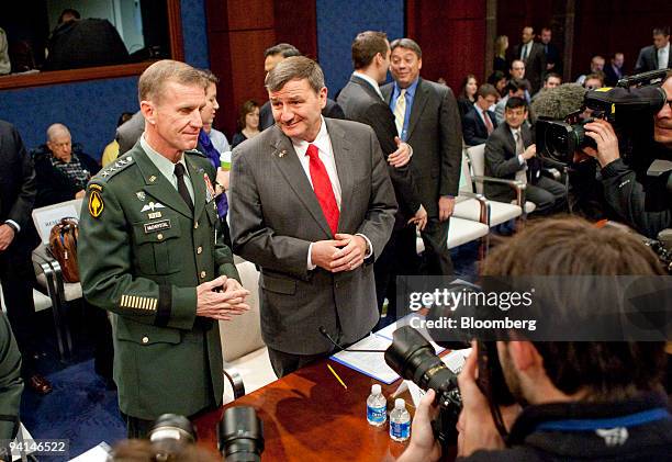 Army General Stanley McChrystal, commander of U.S. Forces in Afghanistan, left, speaks to Karl Eikenberry, U.S. Ambassador to Afghanistan, during a...