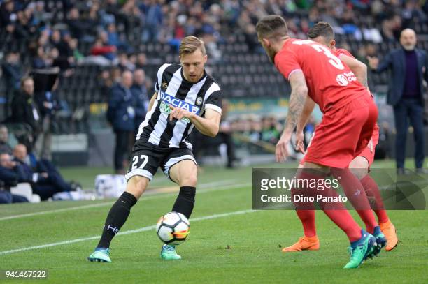 Silvan Widmer of Udinese Calcio competes with Cristiano Biraghi of ACF Fiorentina Stefano Pioli during the serie A match between Udinese Calcio and...