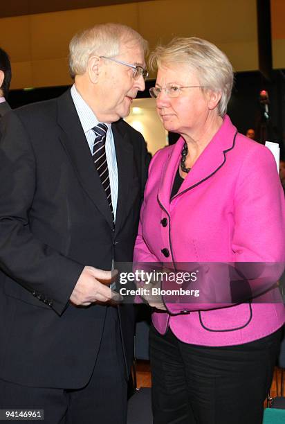 Annette Schavan, Germany's minister of education and research, right, speaks with Rainer Bruederle, Germany's economy minister, at the IT Summit in...