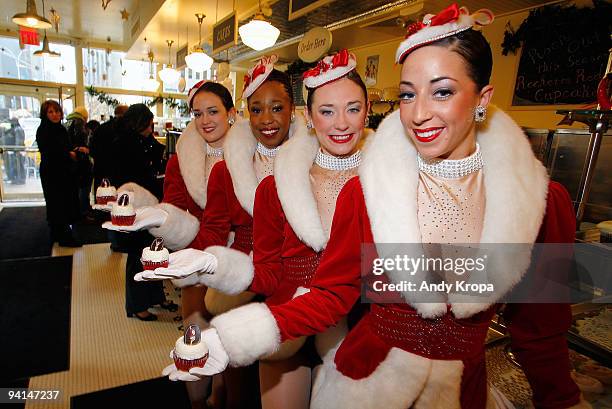 Radio City Rockettes Sagan Rose, Lisa Lewis, Corinne Tighe and Kate Hamrah attend the Rockette red velvet cupcake kick off at Magnolia Bakery...