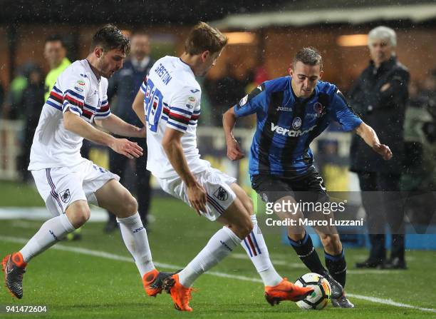 Timothy Castagne of Atalanta BC competes for the ball with Gaston Exequiel Ramirez of UC Sampdoria during the serie A match between Atalanta BC and...