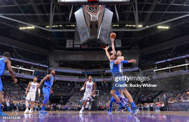 Kosta Koufos of the Sacramento Kings shoots against Salah Mejri of the Dallas Mavericks on March 27, 2018 at Golden 1 Center in Sacramento,...