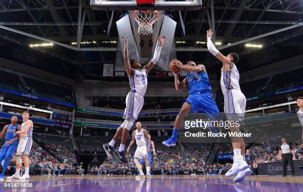 Aaron Harrison of the Dallas Mavericks goes up for the shot against De'Aaron Fox of the Sacramento Kings on March 27, 2018 at Golden 1 Center in...