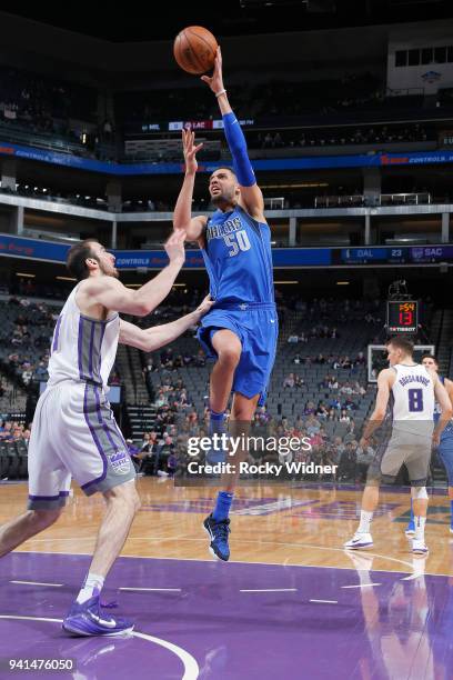 Salah Mejri of the Dallas Mavericks shoots against Kosta Koufos of the Sacramento Kings on March 27, 2018 at Golden 1 Center in Sacramento,...